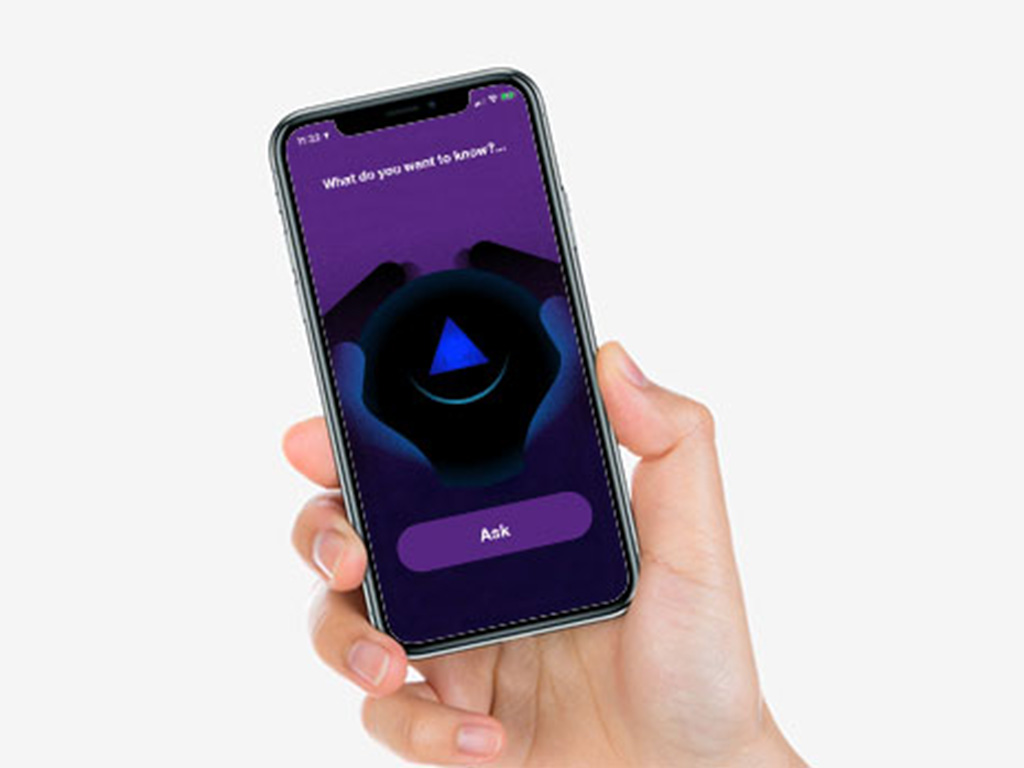 Person holding a phone with a eight ball game on the screen